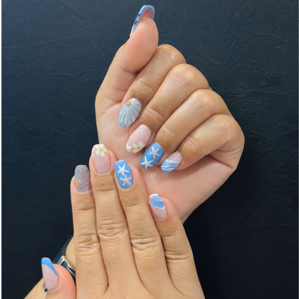 Hand-painted nail art design at a ladies salon in Seeb